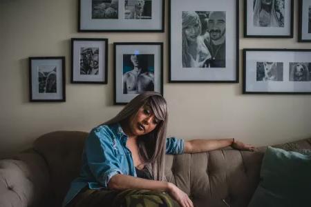 Portrait of Nya Cruz on the couch.